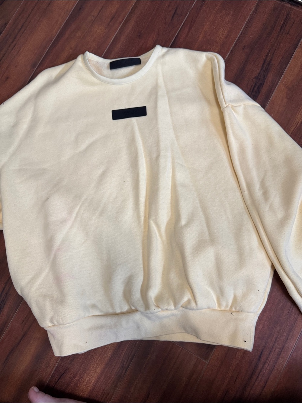 Essentials Cream Crewneck with Black Patch Detail side pockets